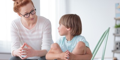 Mother talking to young son